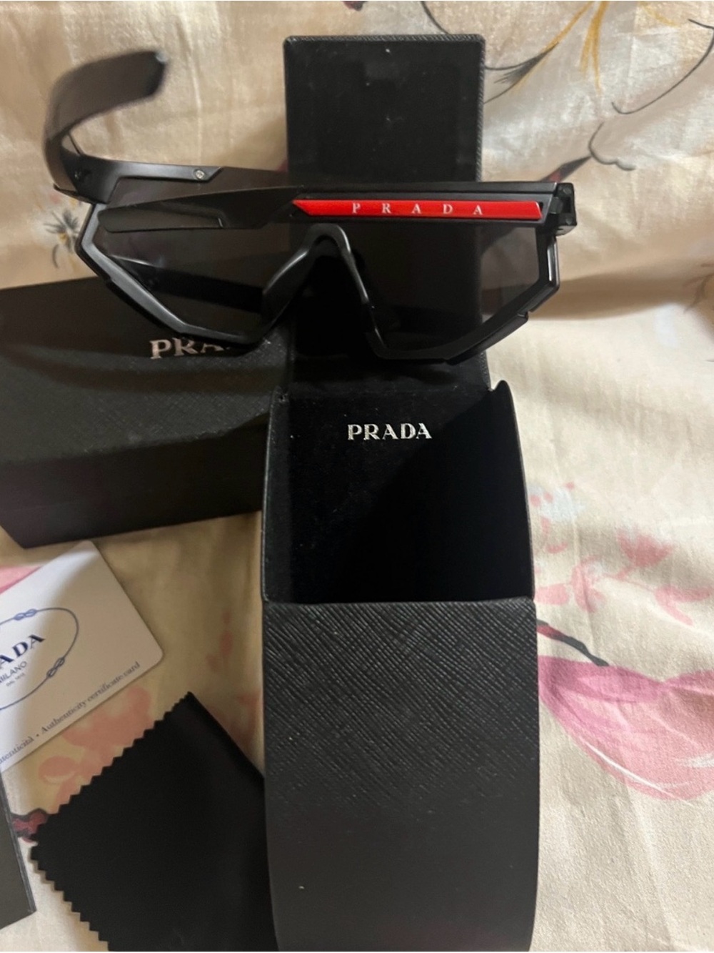 Prada Shield Sunglasses in Black with Red Brow Accent